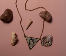 Necklace around rocks and sea shells.